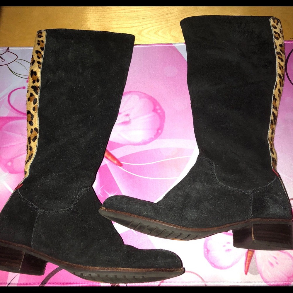 Black suede boots with animal print trim on back.